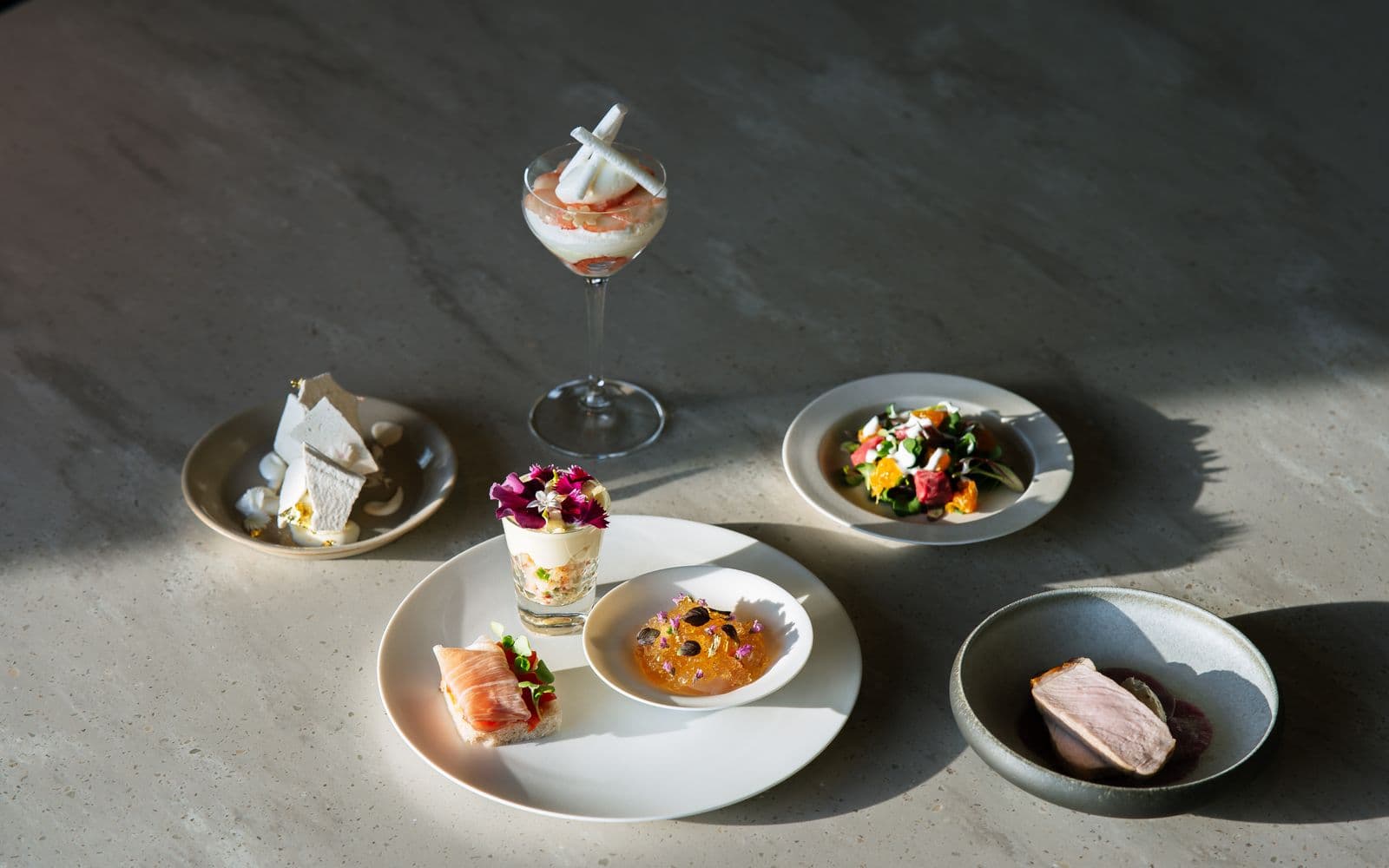 An elegant fine dining tasting menu of artfully plated gourmet dishes
